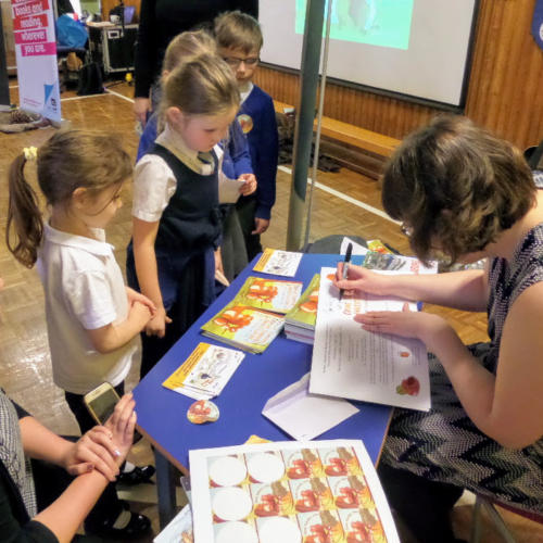 Emily Dodd signing books at Slamannan Primary.